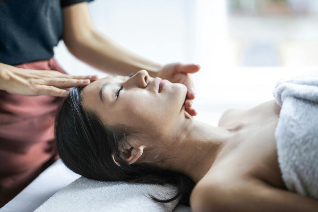 A women taking asian massage session at Garden Retreat Spa